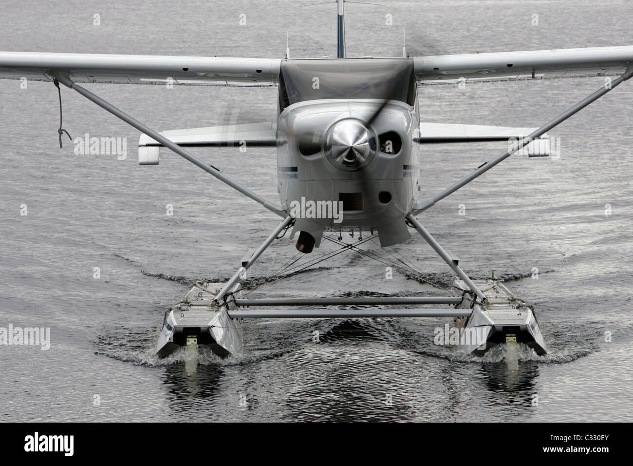 One of Loch Lomond Seaplanes aircraft taxiing towards shore on Loch Lomond Stock Photo