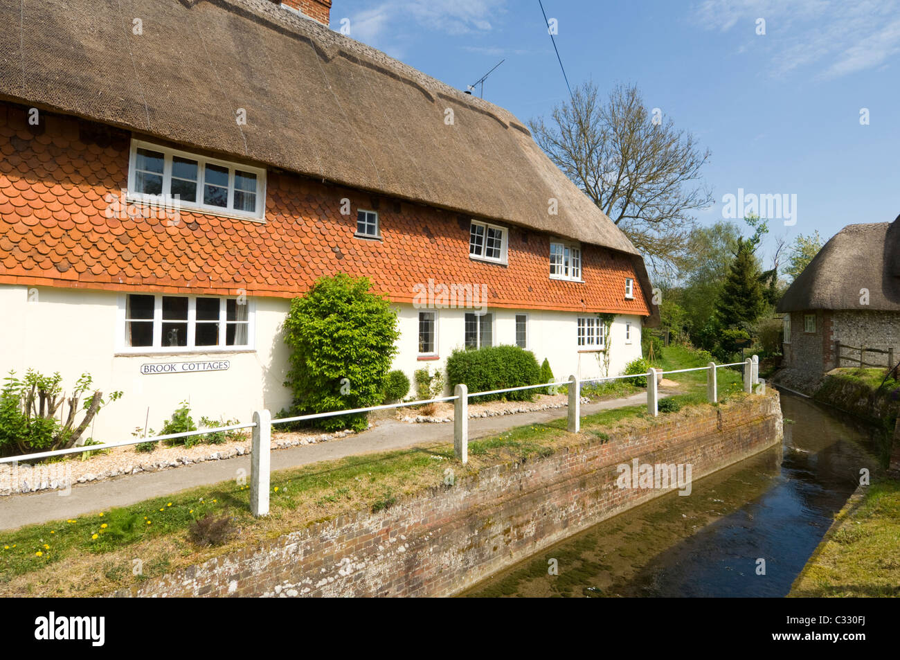 Cottage along the Meon River East Meon Hampshire UK Stock Photo