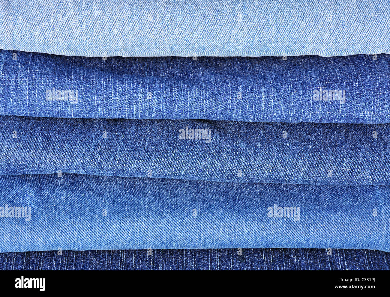 Jeans stack background Stock Photo - Alamy