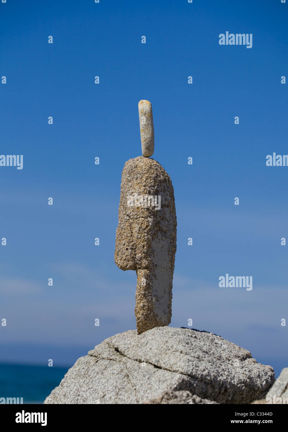 Rock balancing - finely balanced and creative stone stacking on the coast of central California Stock Photo