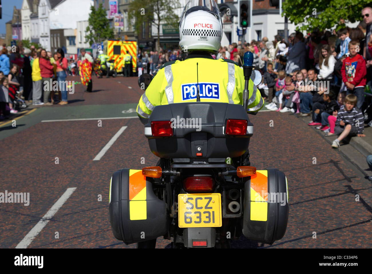 psni police motorcycle traffic control officer escort during parade in bangor county down northern ireland Stock Photo