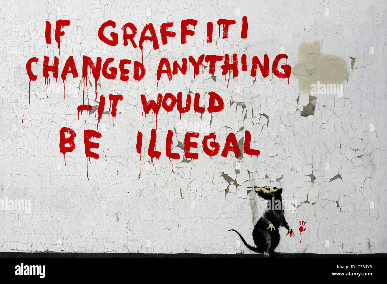 Banksy Graffiti on a London wall, If graffiti changed anything - it would be illegal Stock Photo
