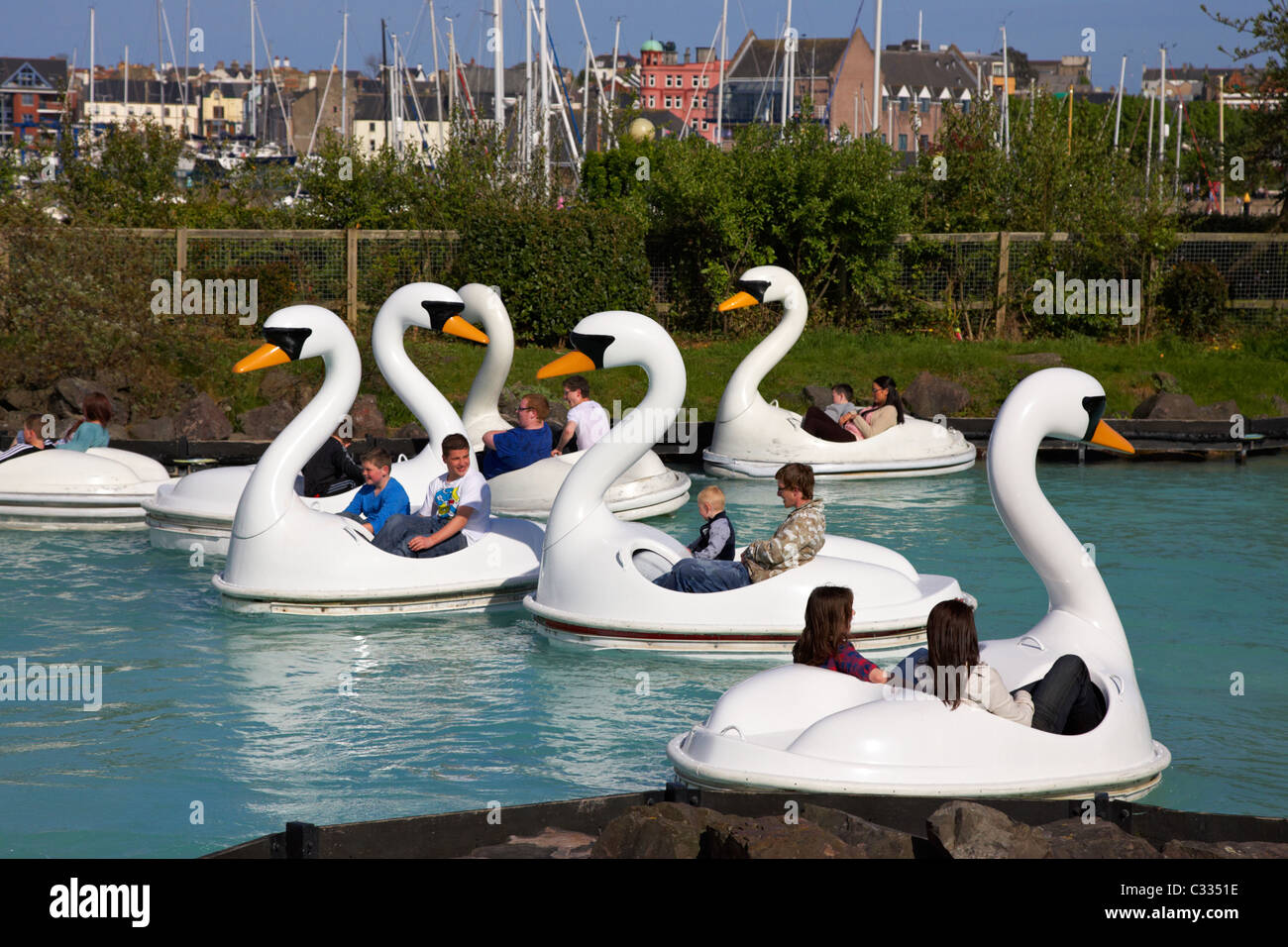 families pedalling the swans at pickie family fun park in Bangor County Down Northern Ireland uk Stock Photo