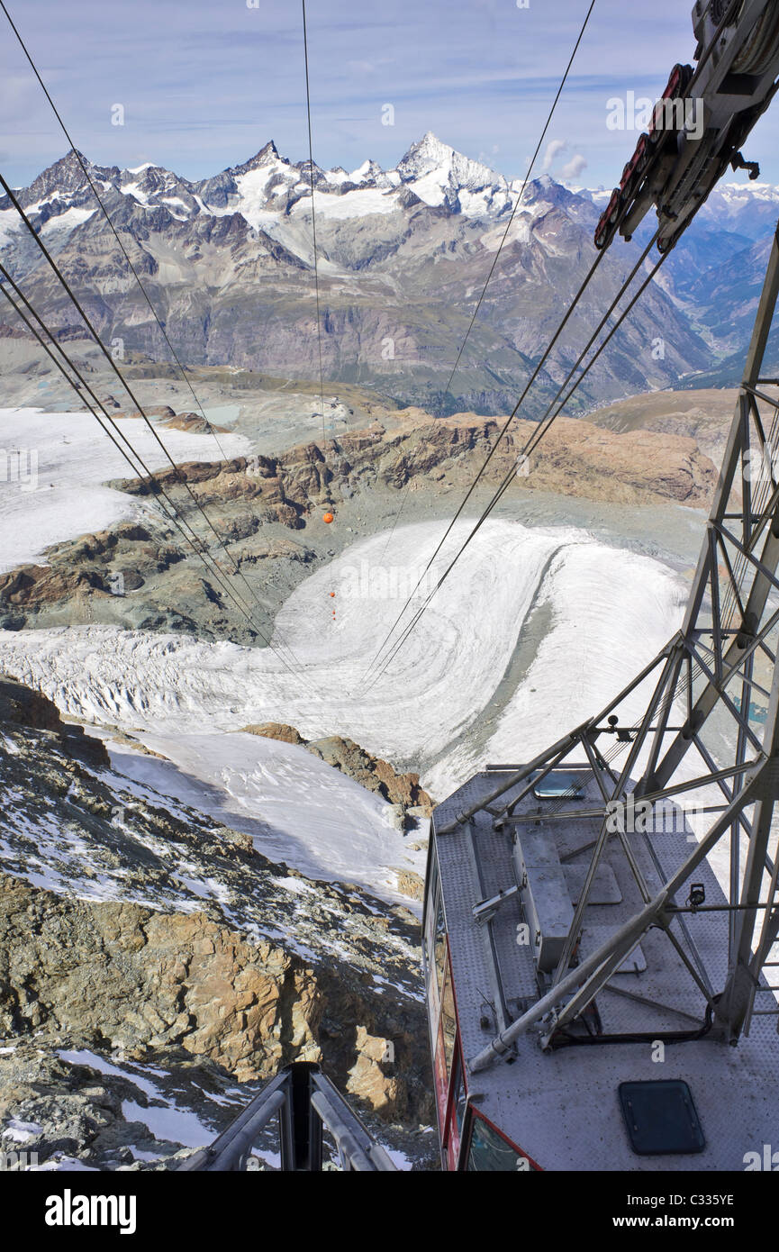 Cable car suspended across a huge mountain glacier Stock Photo Alamy