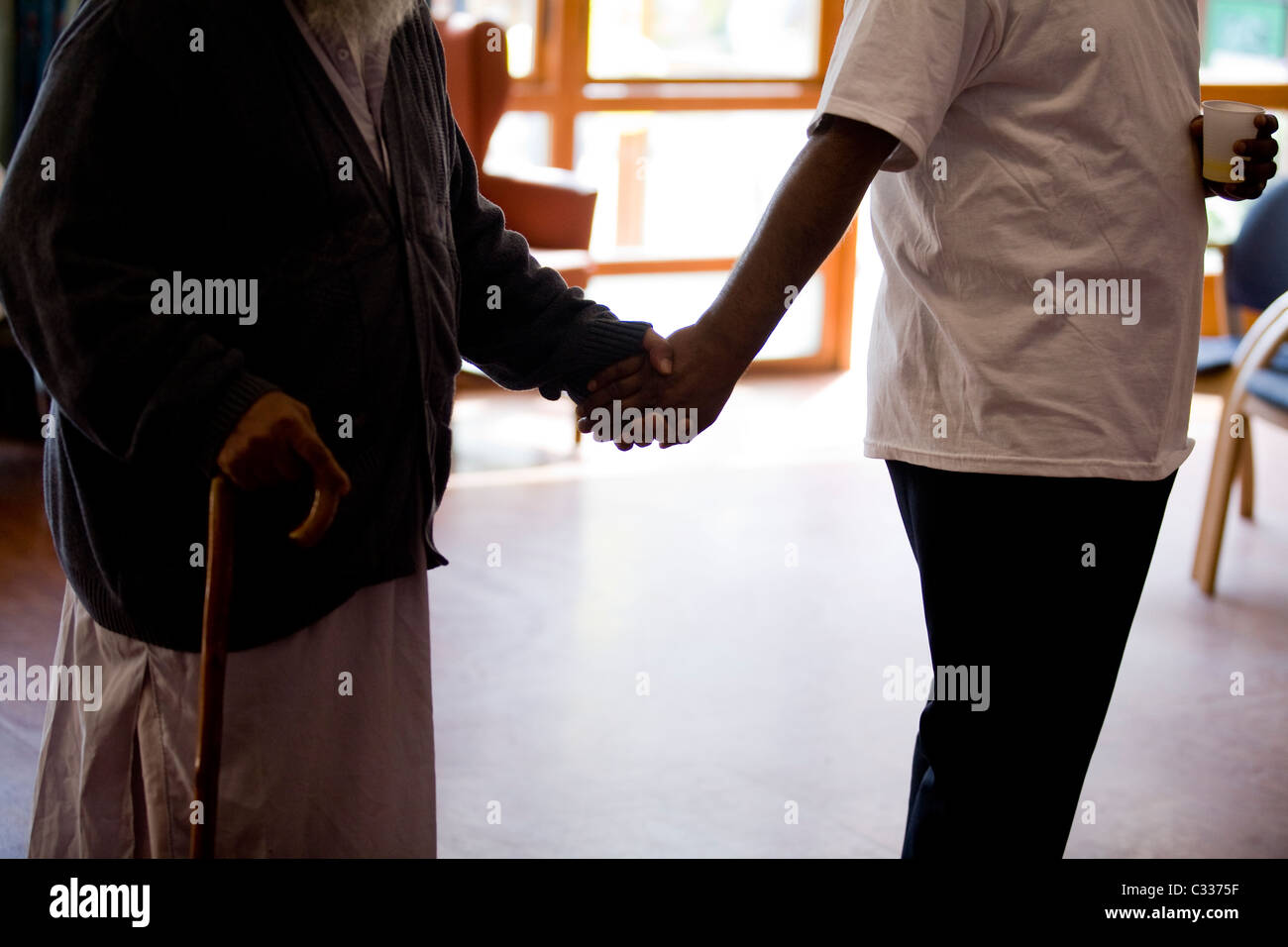 Old person with carer Stock Photo