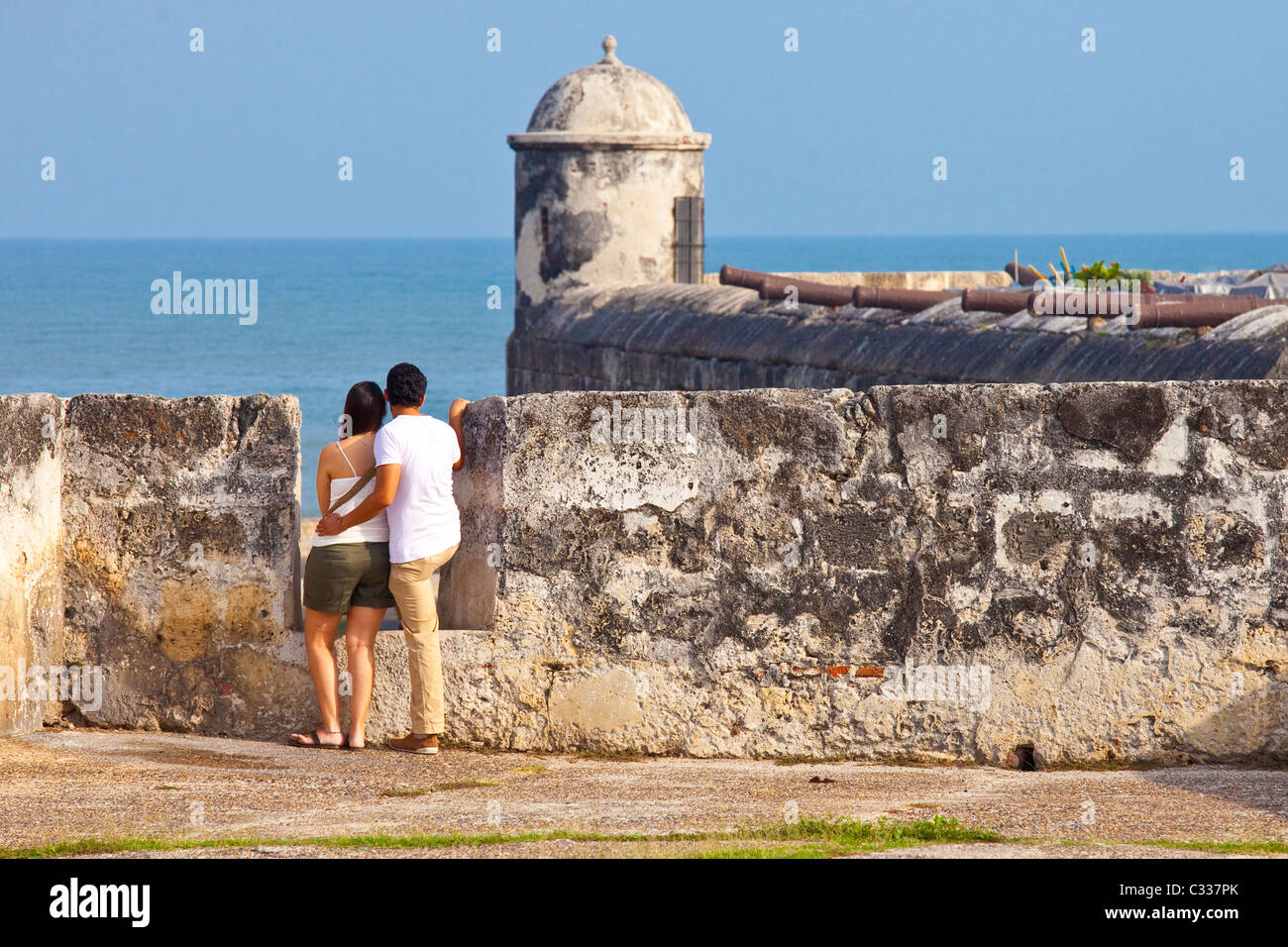 Young couple on the old city walls, Cartagena, Colombia Stock Photo