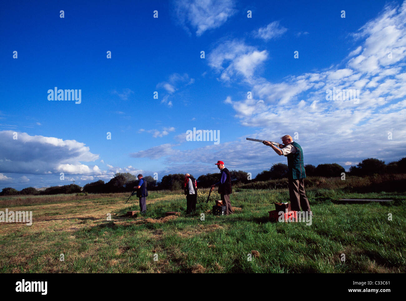 Men Practice Shooting With Rifles Stock Photo