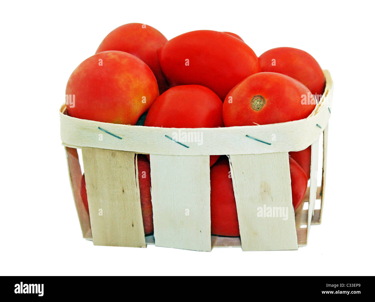 tomatoes in a basket isolated on white Stock Photo - Alamy