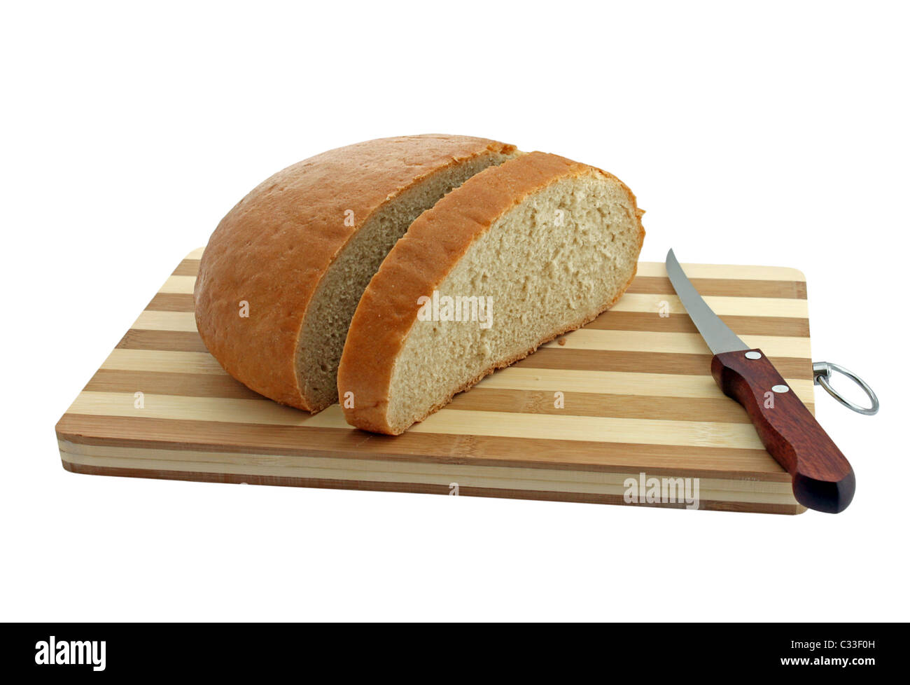 loaf of bread and knife on a cutting board Stock Photo
