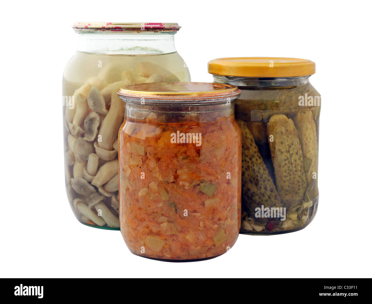 sealed jars with mushrooms, cucumbers and marrow paste Stock Photo
