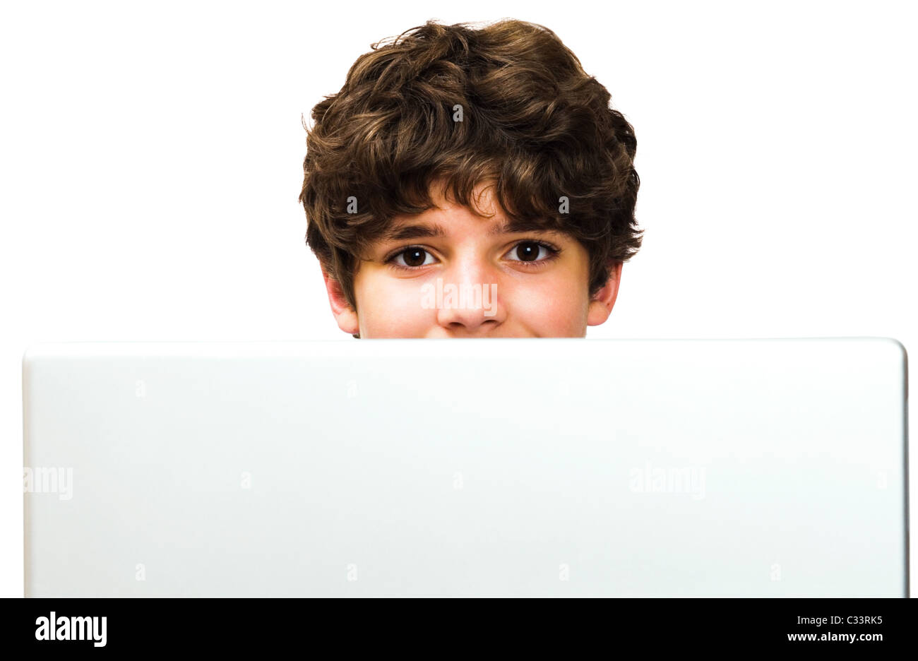 Portrait of a boy using a laptop isolated over white Stock Photo - Alamy
