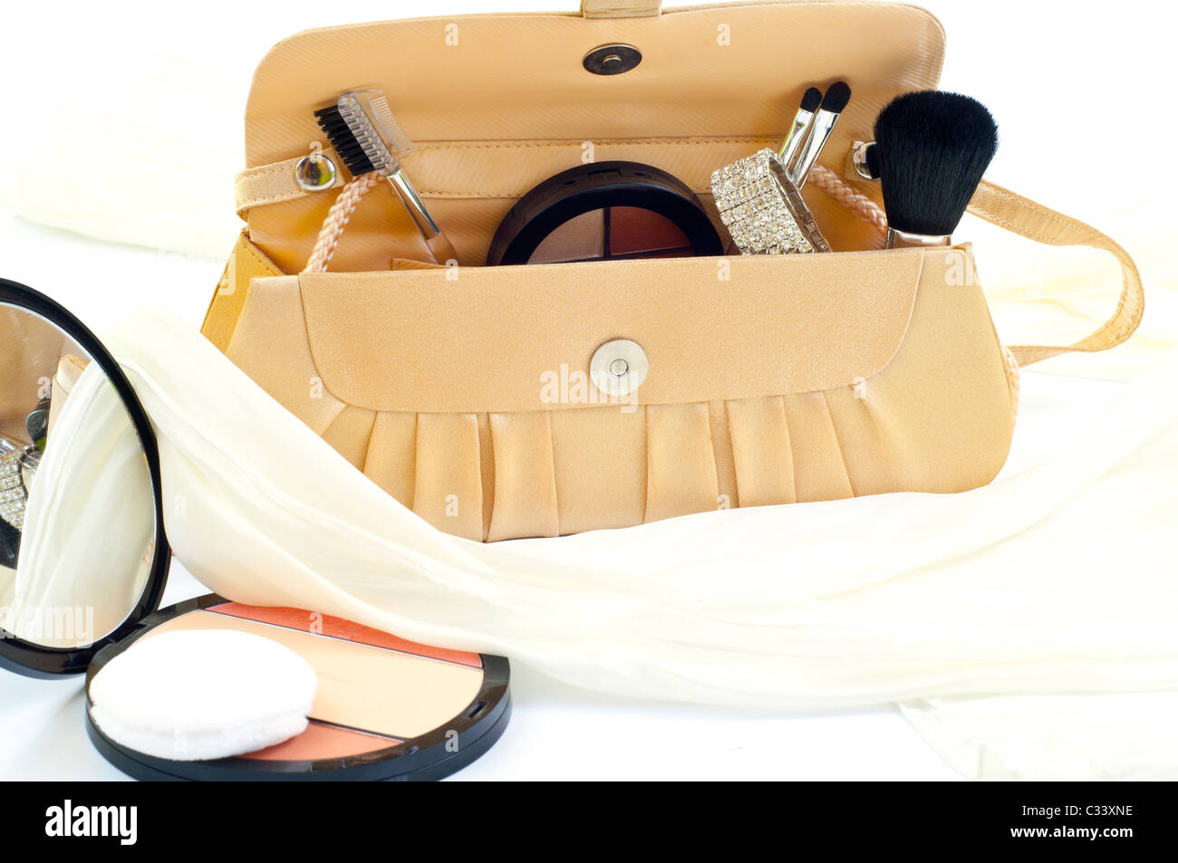 makeup brushes and blush in handbag Stock Photo
