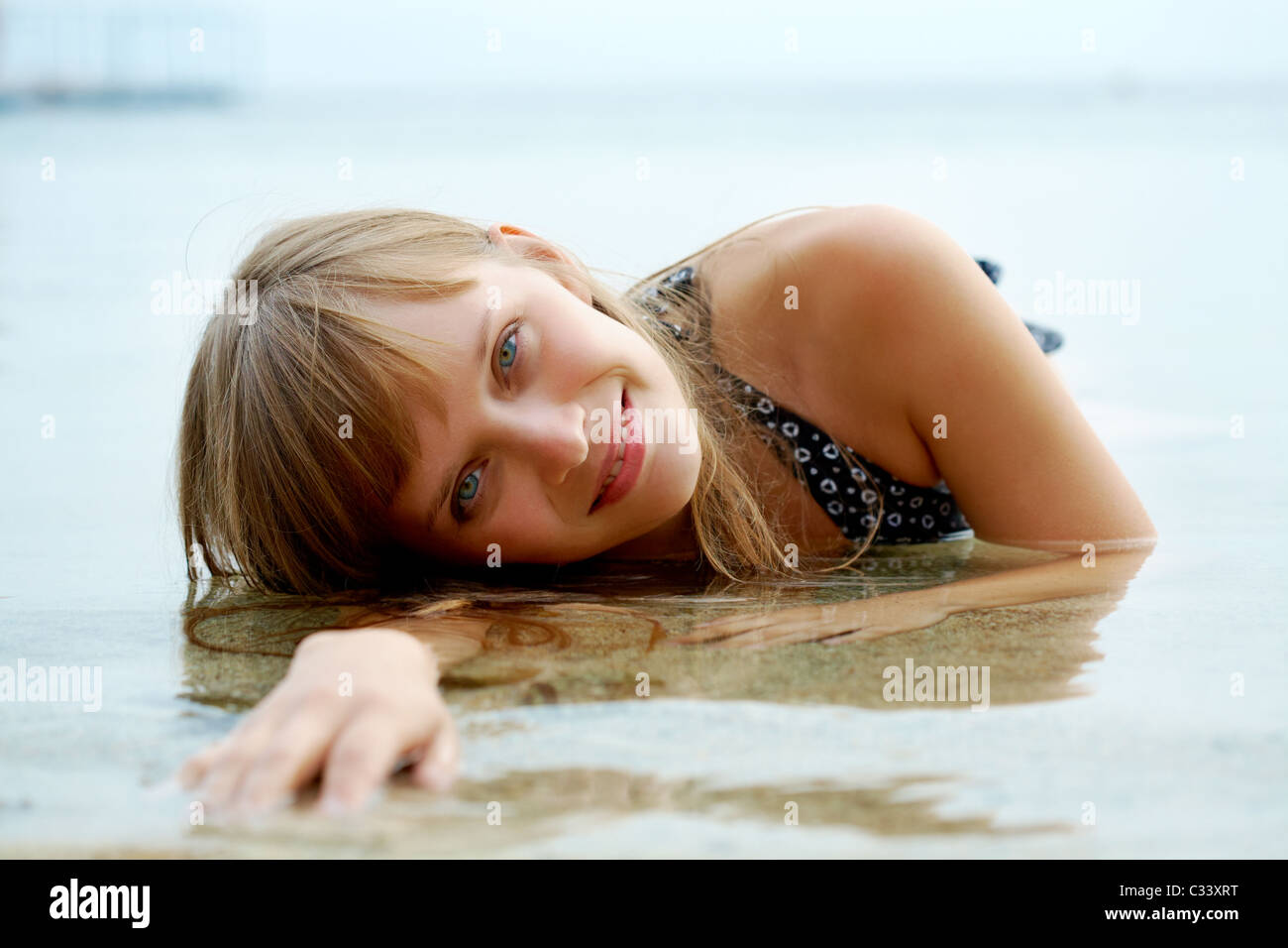 Portrait of pretty young lady having rest in water Stock Photo
