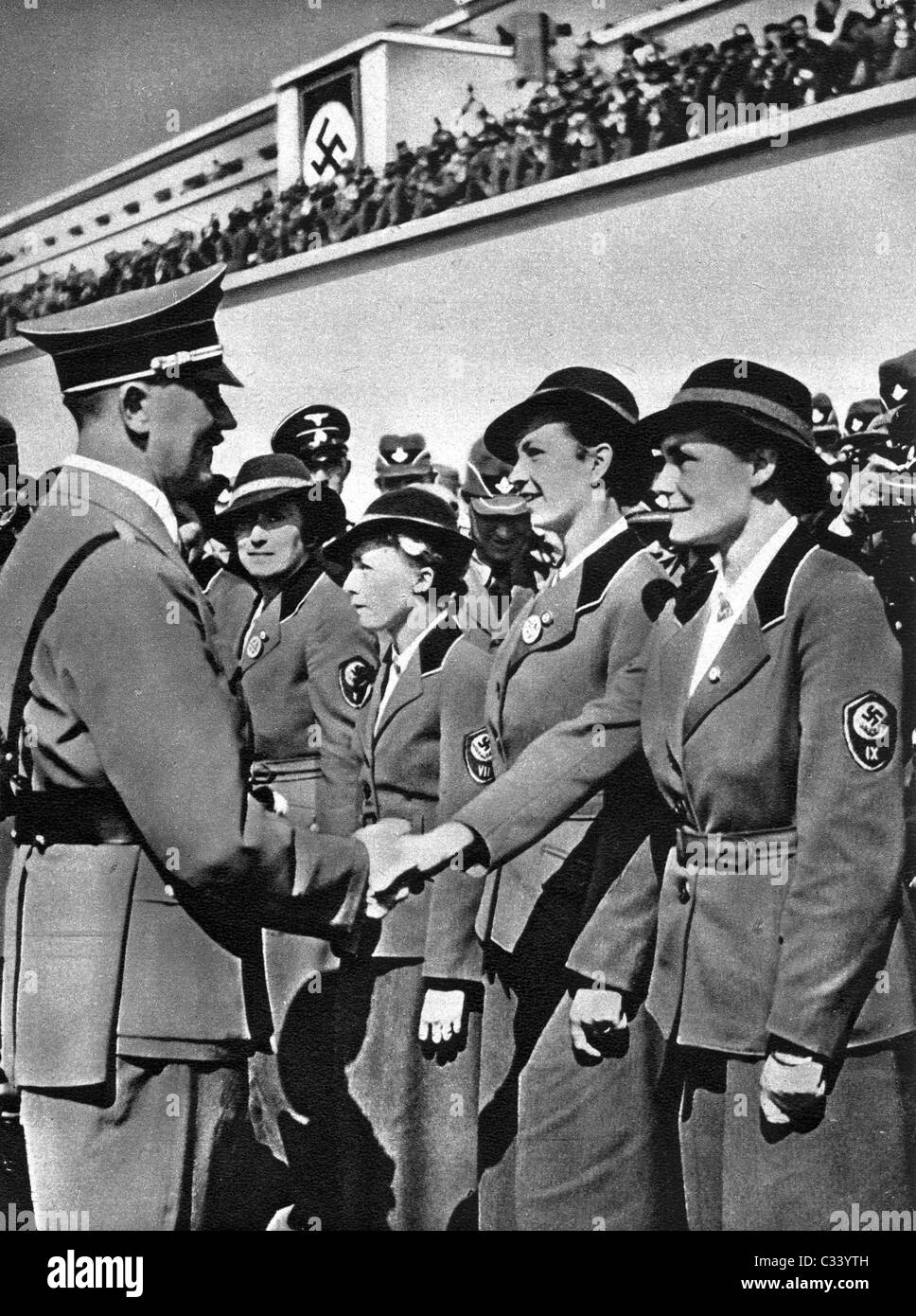 RADWJ (young womens labor organizatIon) officers greeting Fuhrer Adolf Hitler. Germany c1939. Stock Photo