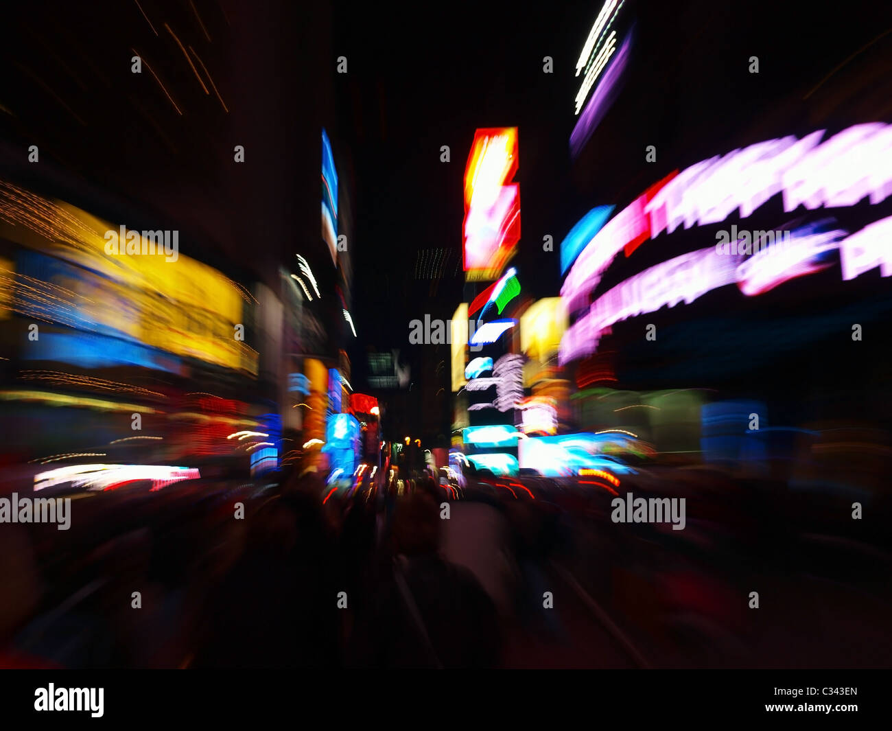 An abstract night view of Times Square with zoom burst effect on the
