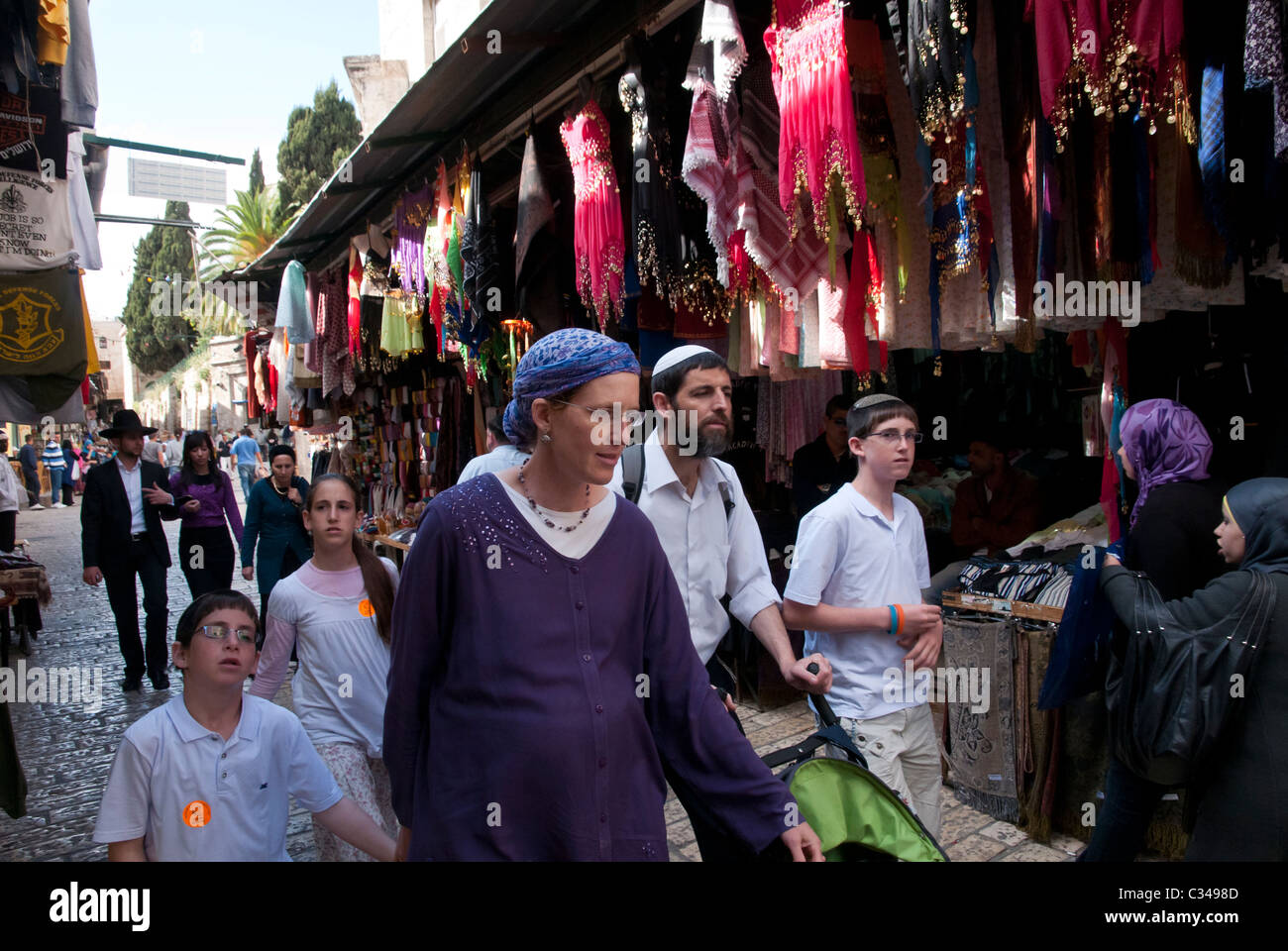 Jewish family strolling in the streets of the Old City. Jerusalem. Stock Photo