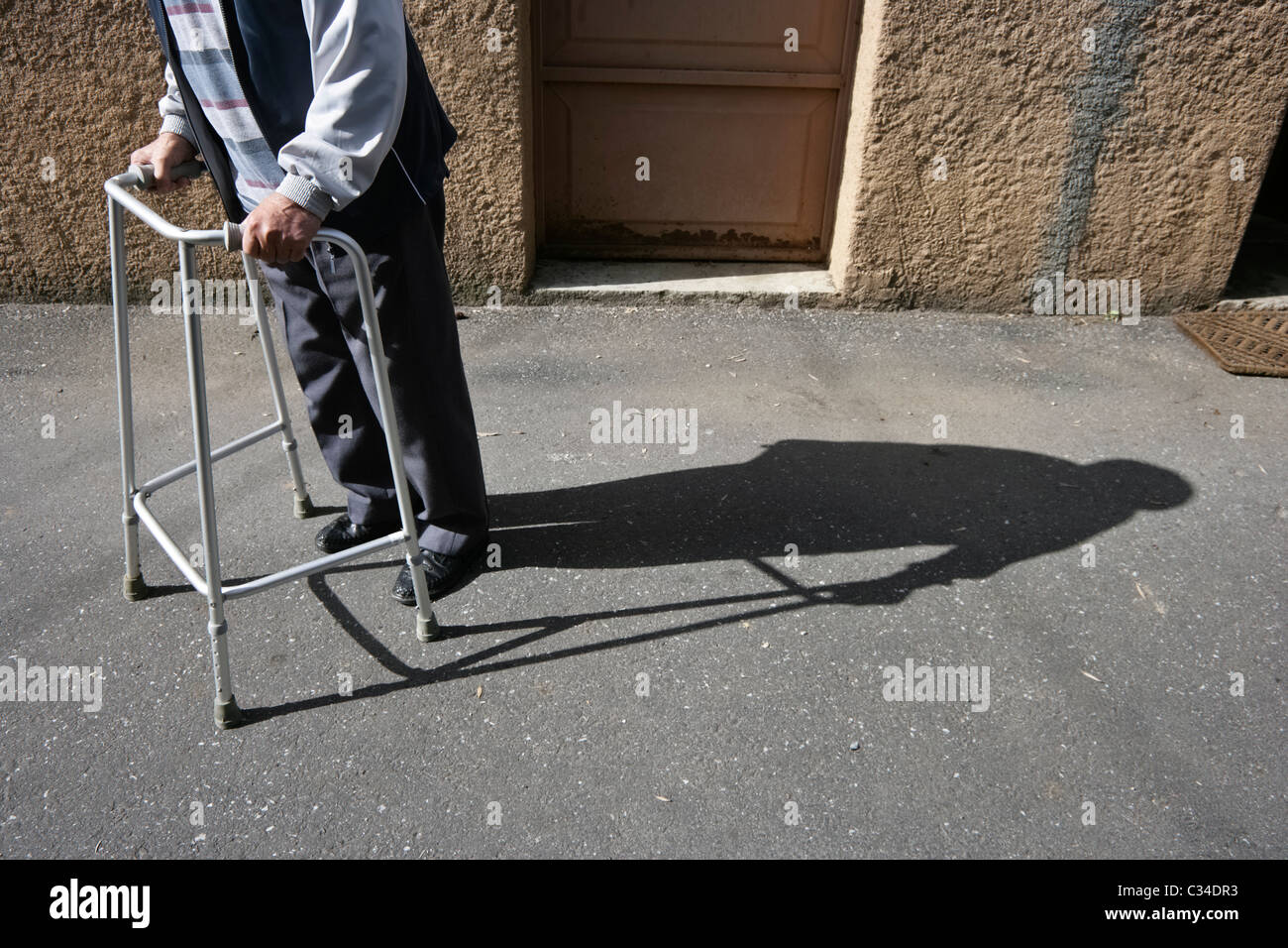 Elderly person with a walker Stock Photo