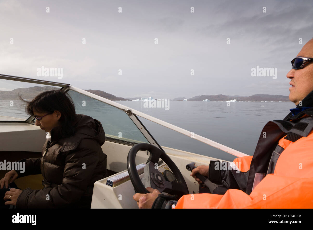People on a boat in the fjord outside Narsaq, South Greenland. Stock Photo