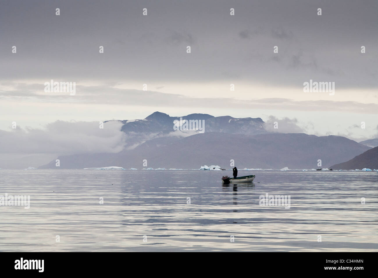 Seal hunters looking for seals, South Greenland Stock Photo