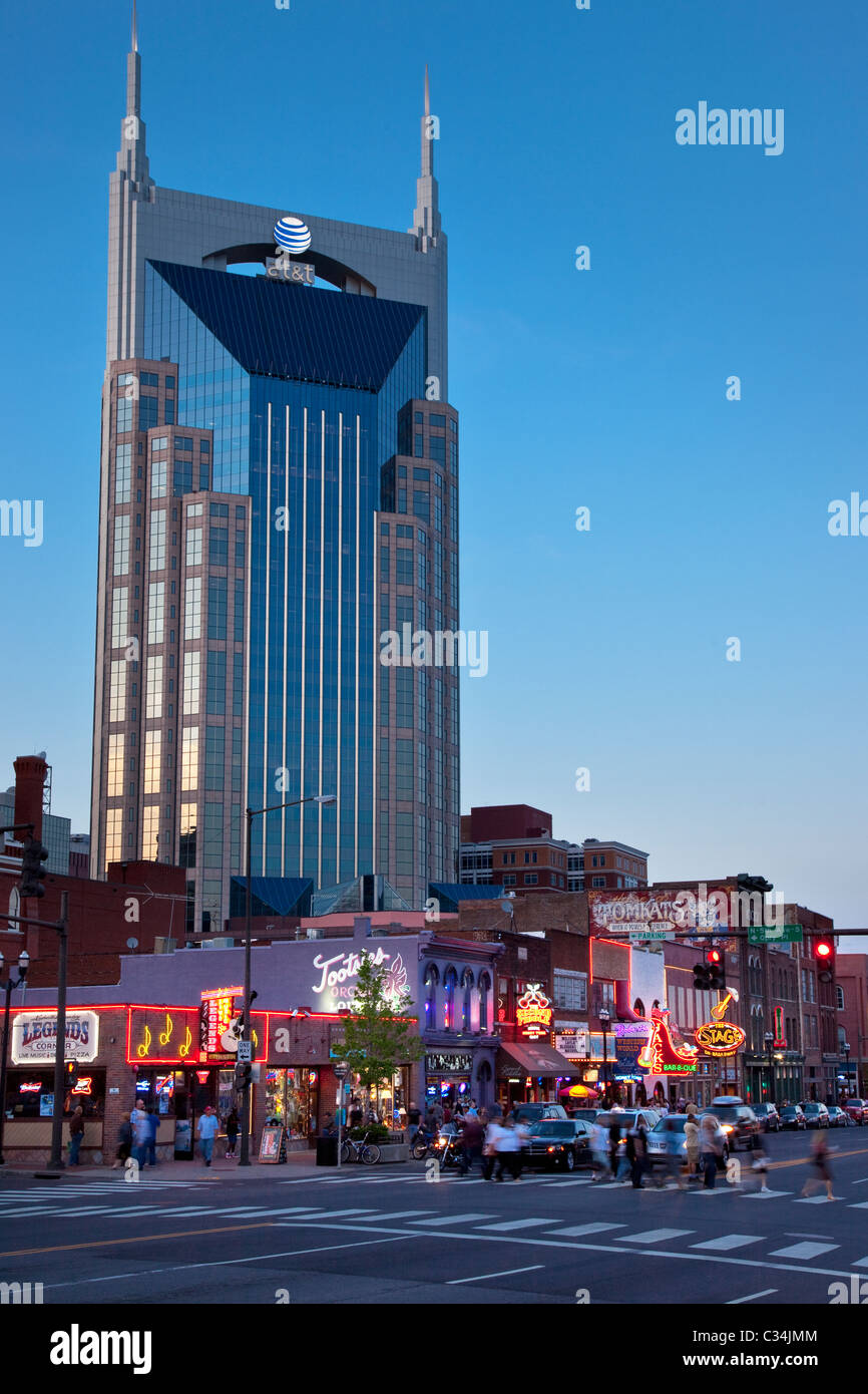 The AT&T building towers over the historic bars and honky-tonks along lower Broadway in Nashville Tennessee USA Stock Photo