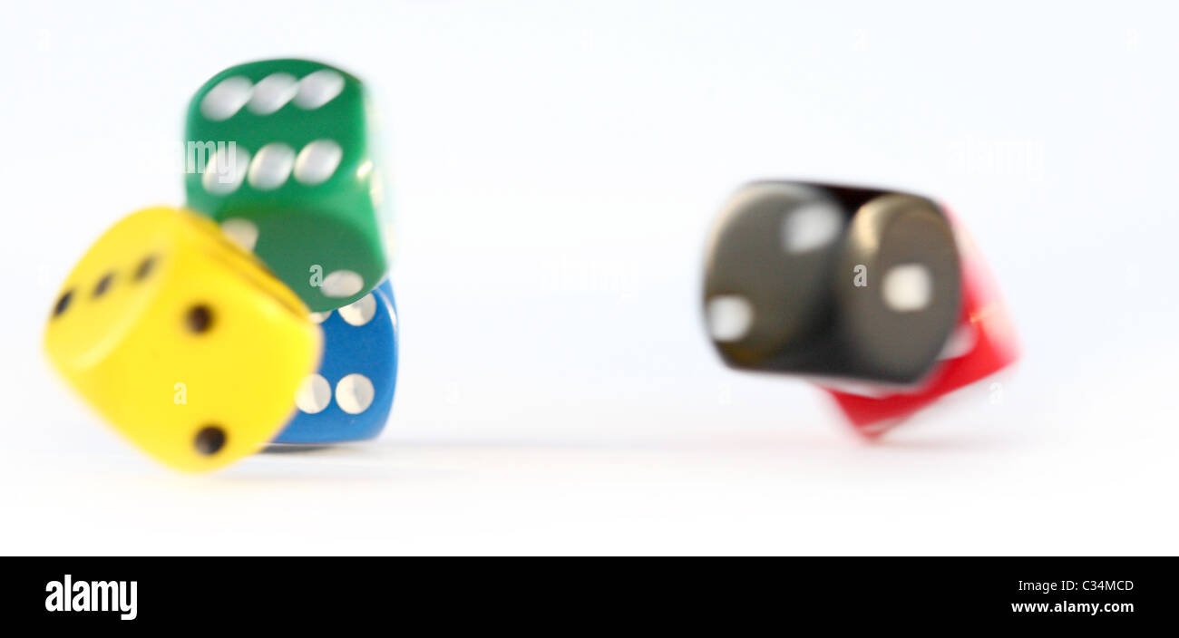 Multi colored dice rolling Stock Photo Alamy