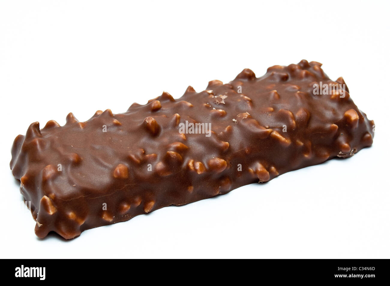 Chocolate and cheese dessert with ground peanuts isolated on white Stock Photo