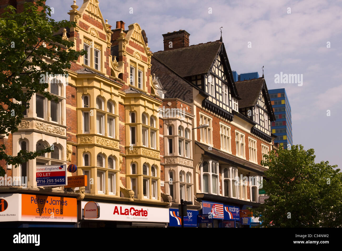 Attractive ornate architecture above shop fronts on Granby Street in Leicester City Centre. Stock Photo