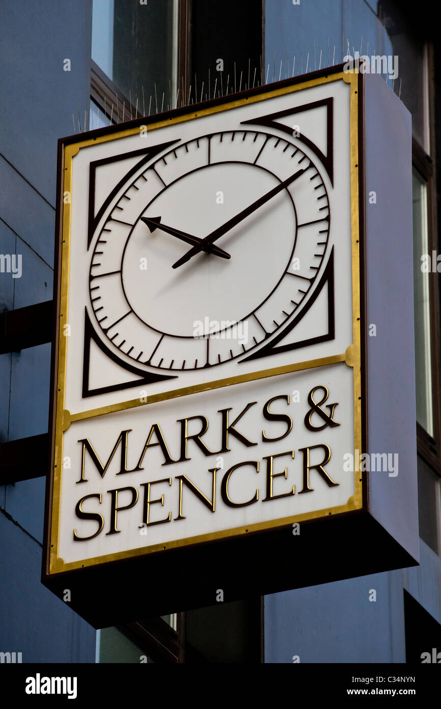 A Marks & Spencer Retail Sign Incorporating a Public Clock Stock Photo