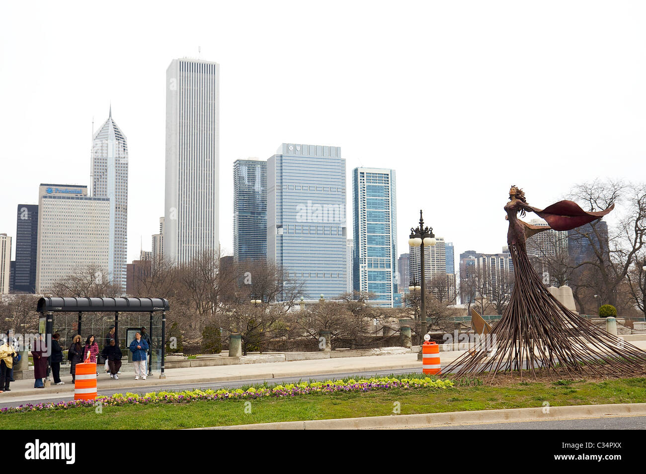 Art Nouveau sculpture on a street near a bus stop in downtown Chicago, modern skyline in the background Stock Photo