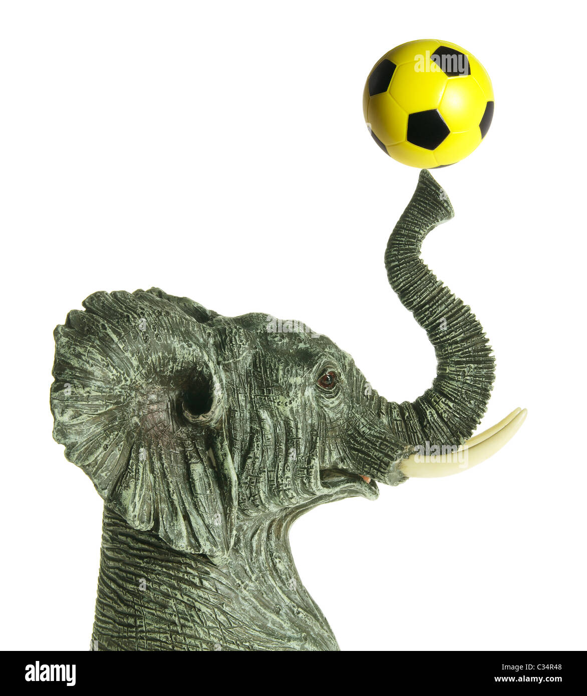 Elephant Figurine with Soccer Ball Stock Photo