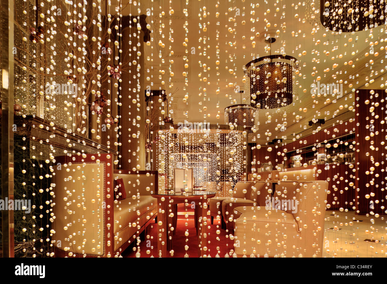 Chef Jun Tanaka Pearl Restaurant and Bar with strings of hand-strung pearls chandeliers as decoration and dividers Stock Photo