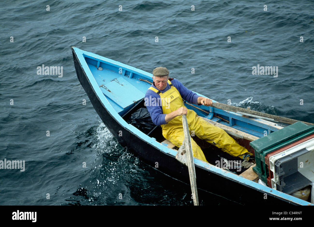 Man In Currach Boat, Aran Islands, County Galway, Ireland Stock Photo