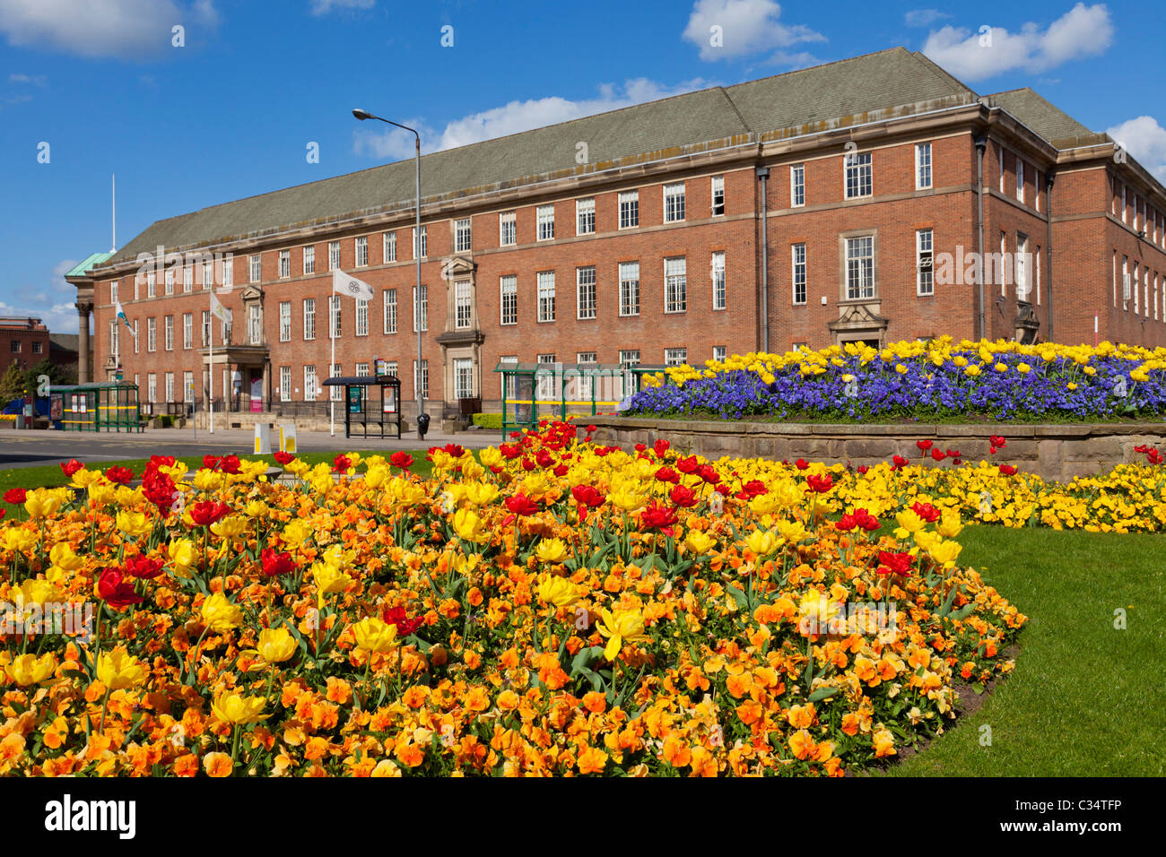 Floral display on a roundabout on Corporation street showing the Council house offices Derby city centre Derbyshire England GB UK Europe Stock Photo