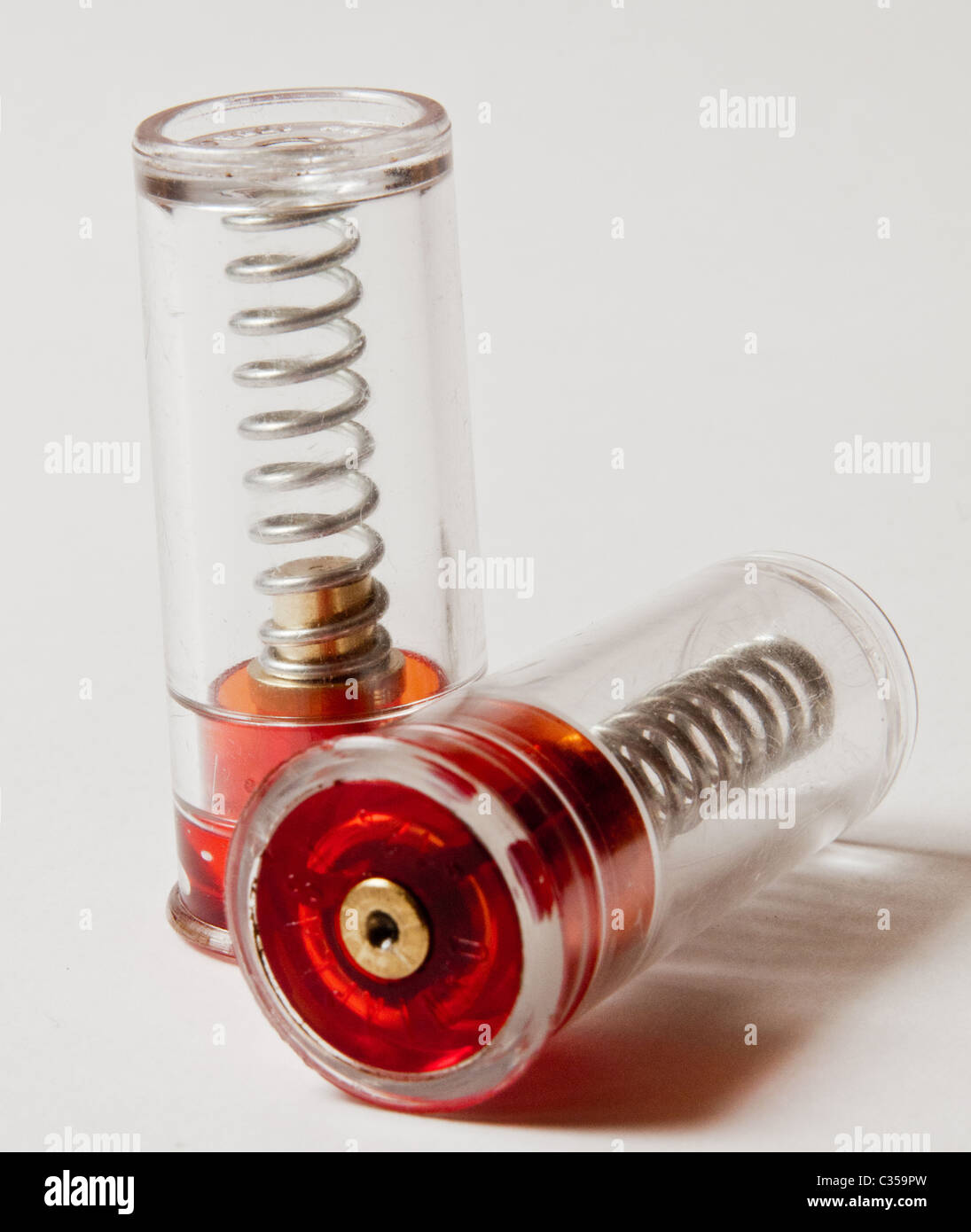 Snap caps, plastic, used to safely fire off the action of a shotgun