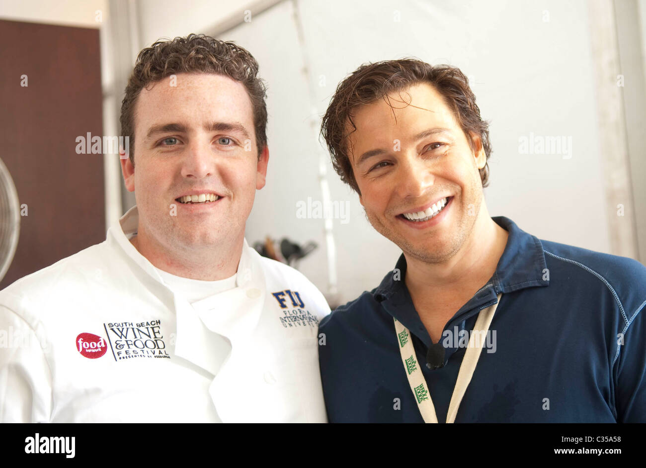 Cooking Personality Rocco DiSpirito, right, was assisted by FIU School of Hospitality student Kevin Purdy 2009 Wine and Food Stock Photo