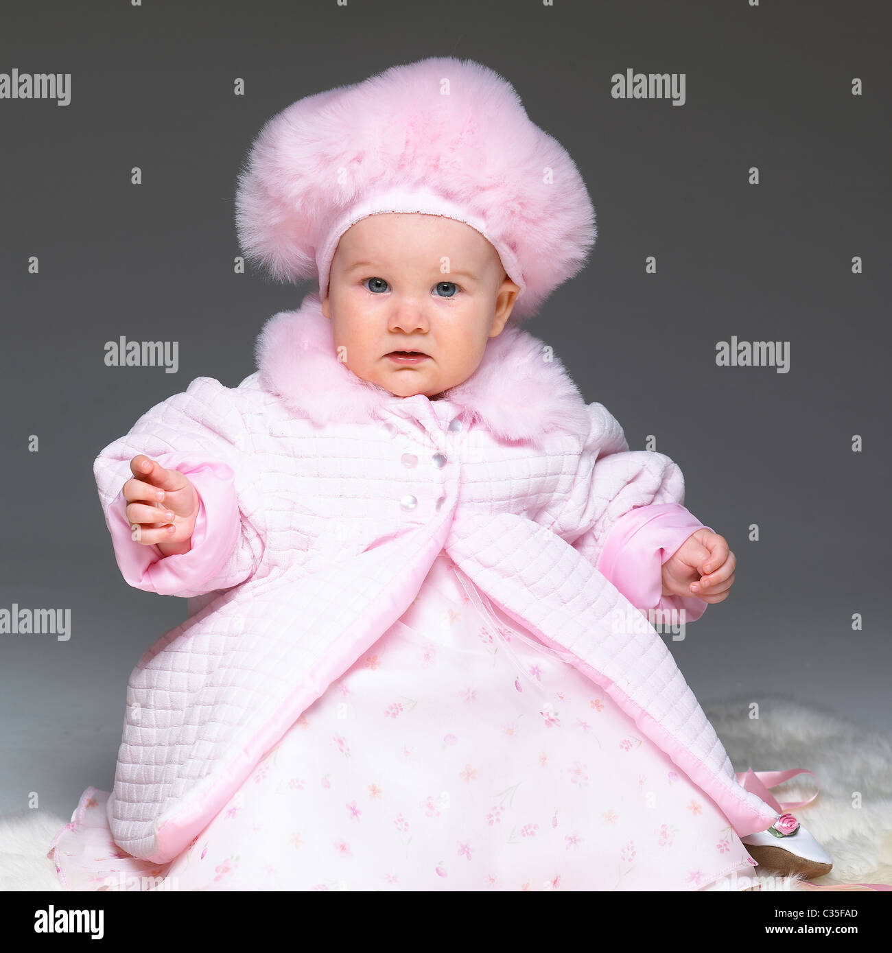 Baby girl in pink outfit Stock Photo - Alamy