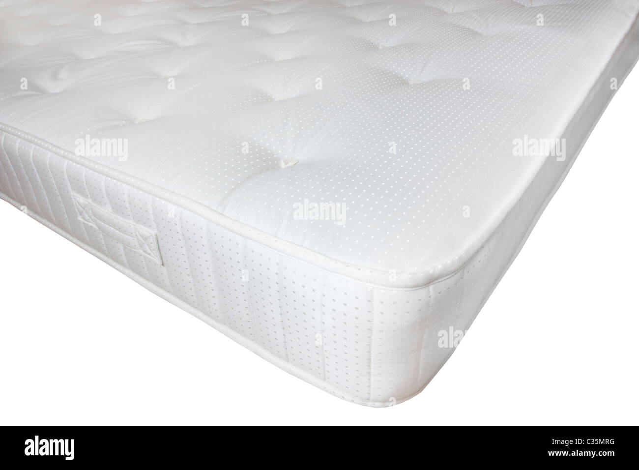 corner of a modern white mattress isolated on a white background Stock Photo