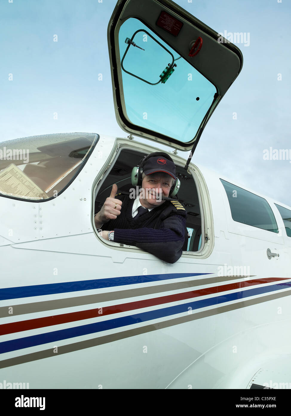 Pilot in cockpit of Cessna plane, Iceland Stock Photo