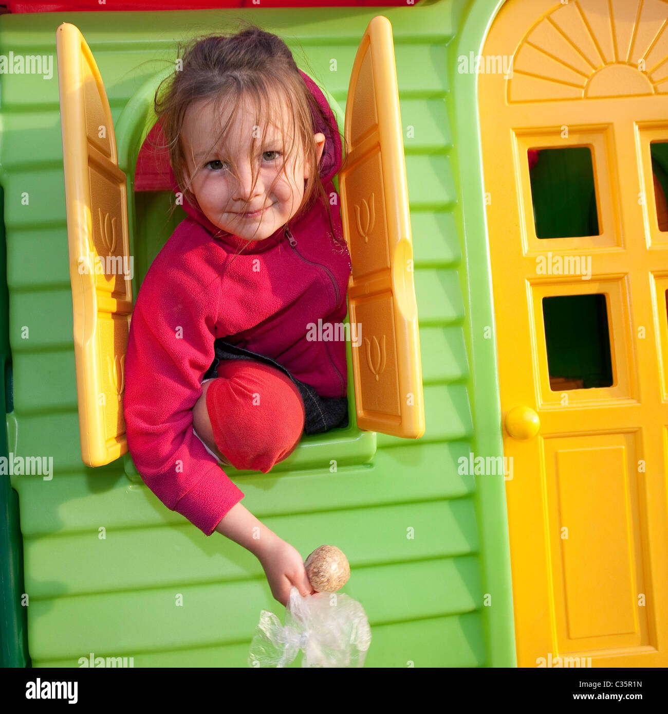 Little girl in playhouse Stock Photo Alamy