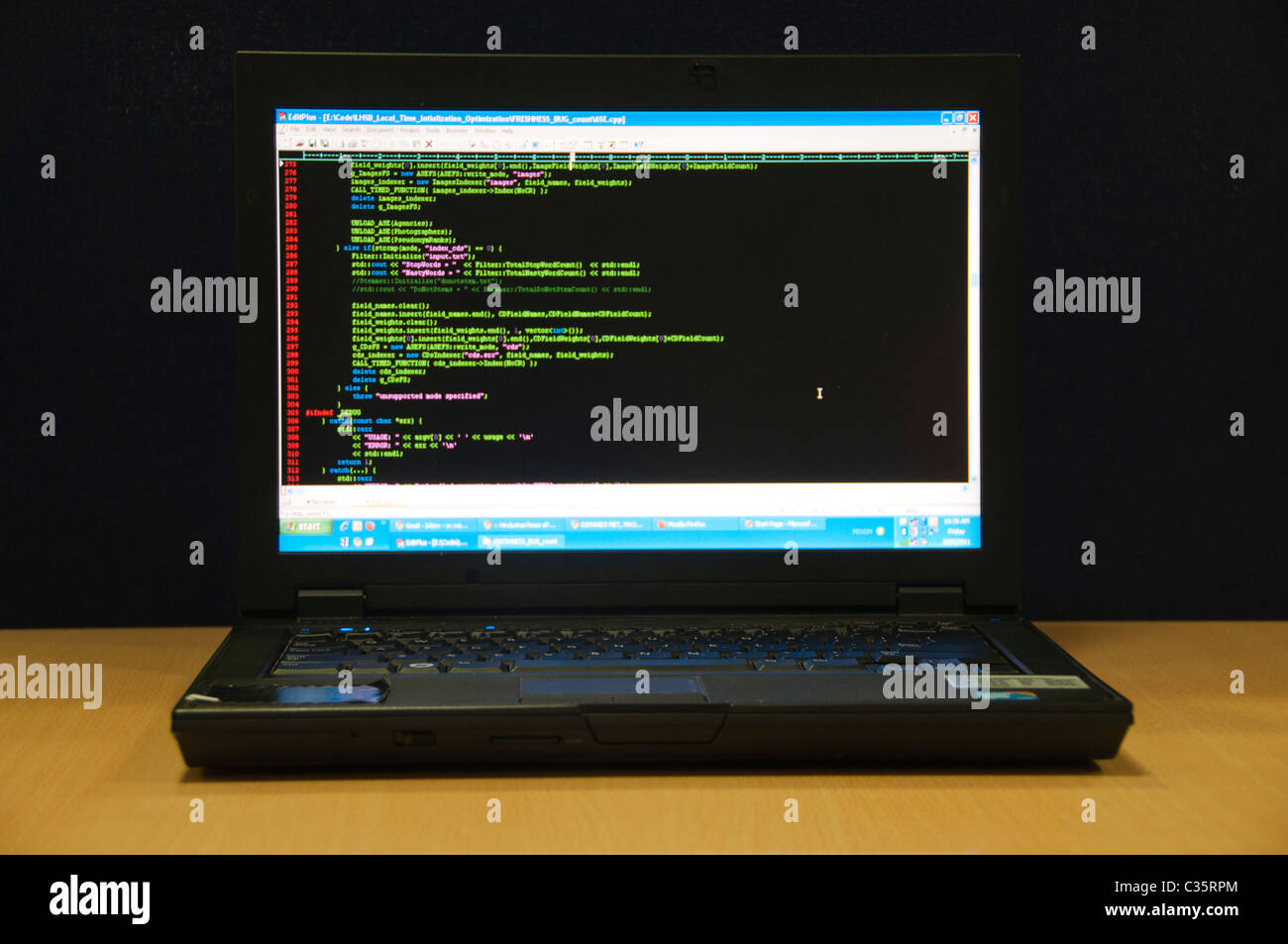 Laptop with program code on screen Stock Photo