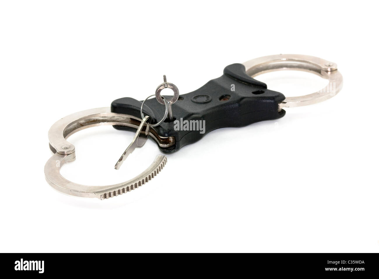 handcuffs on white background open with key Stock Photo