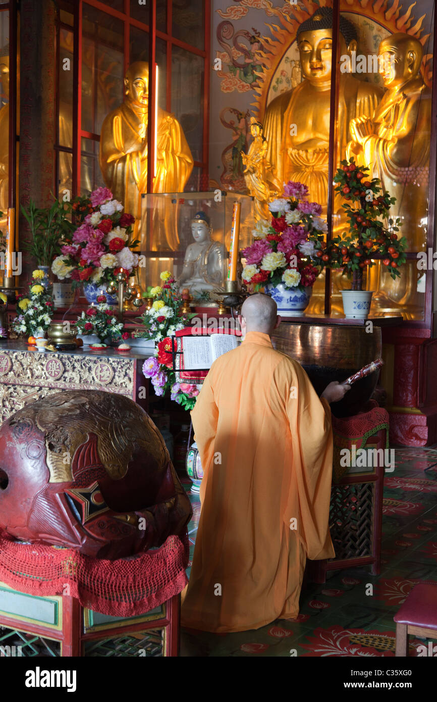 Kek Sok Si Temple, Penang Malaysia- monk beating gong 2 Stock Photo