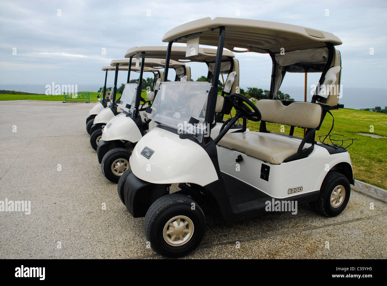Golf carts at White Witch Golf Course, St. James, Jamaica Stock Photo