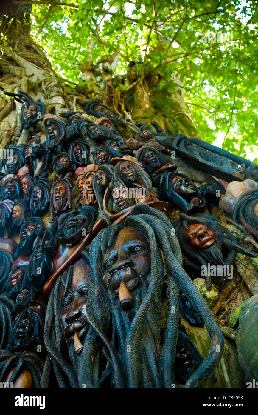 Wood carvings displayed on a tree at Dunn's River Falls, near Ocho Rios, St Ann, Jamaica Stock Photo