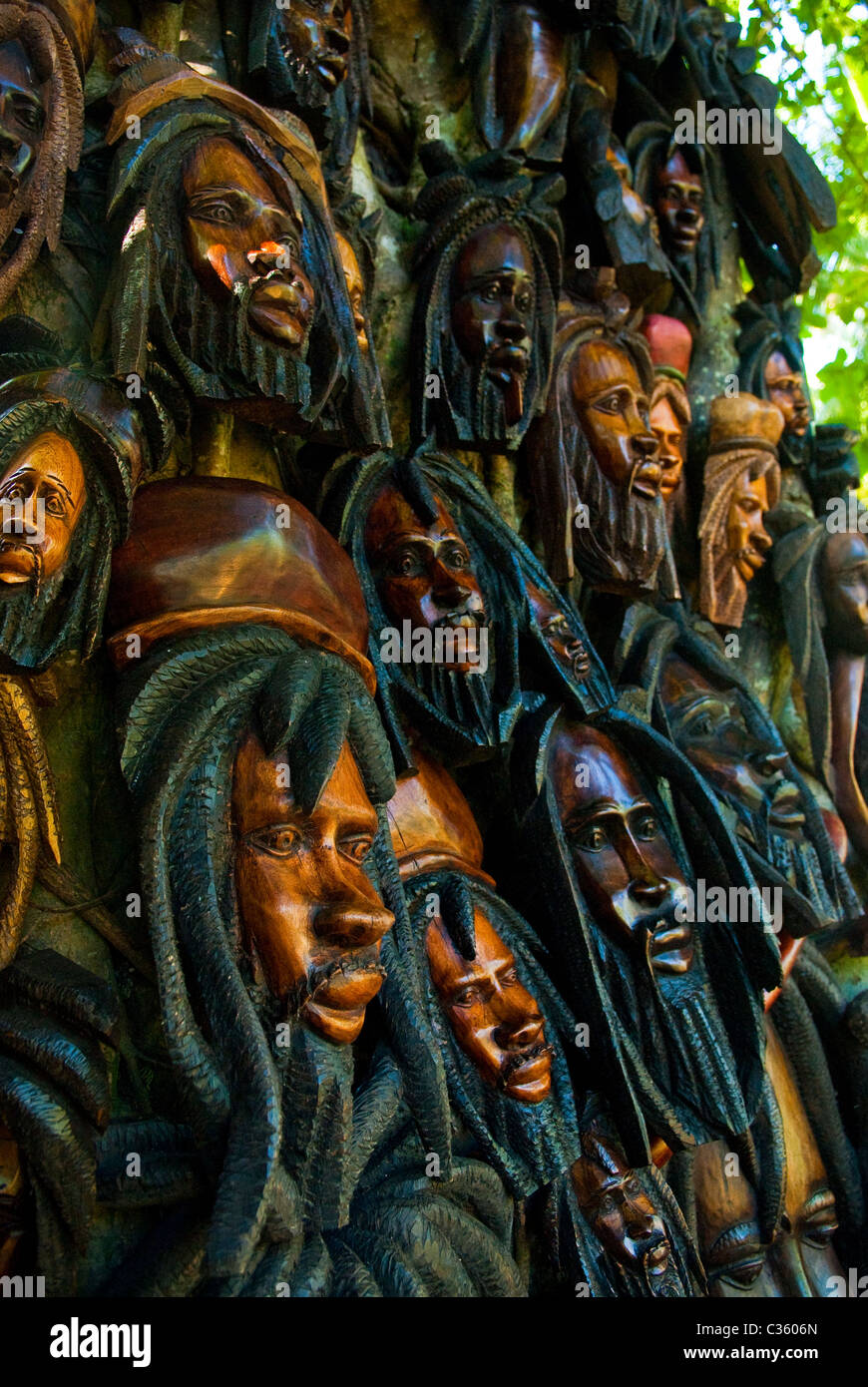 Wood carvings displayed on a tree at Dunn's River Falls, near Ocho Rios, St Ann, Jamaica Stock