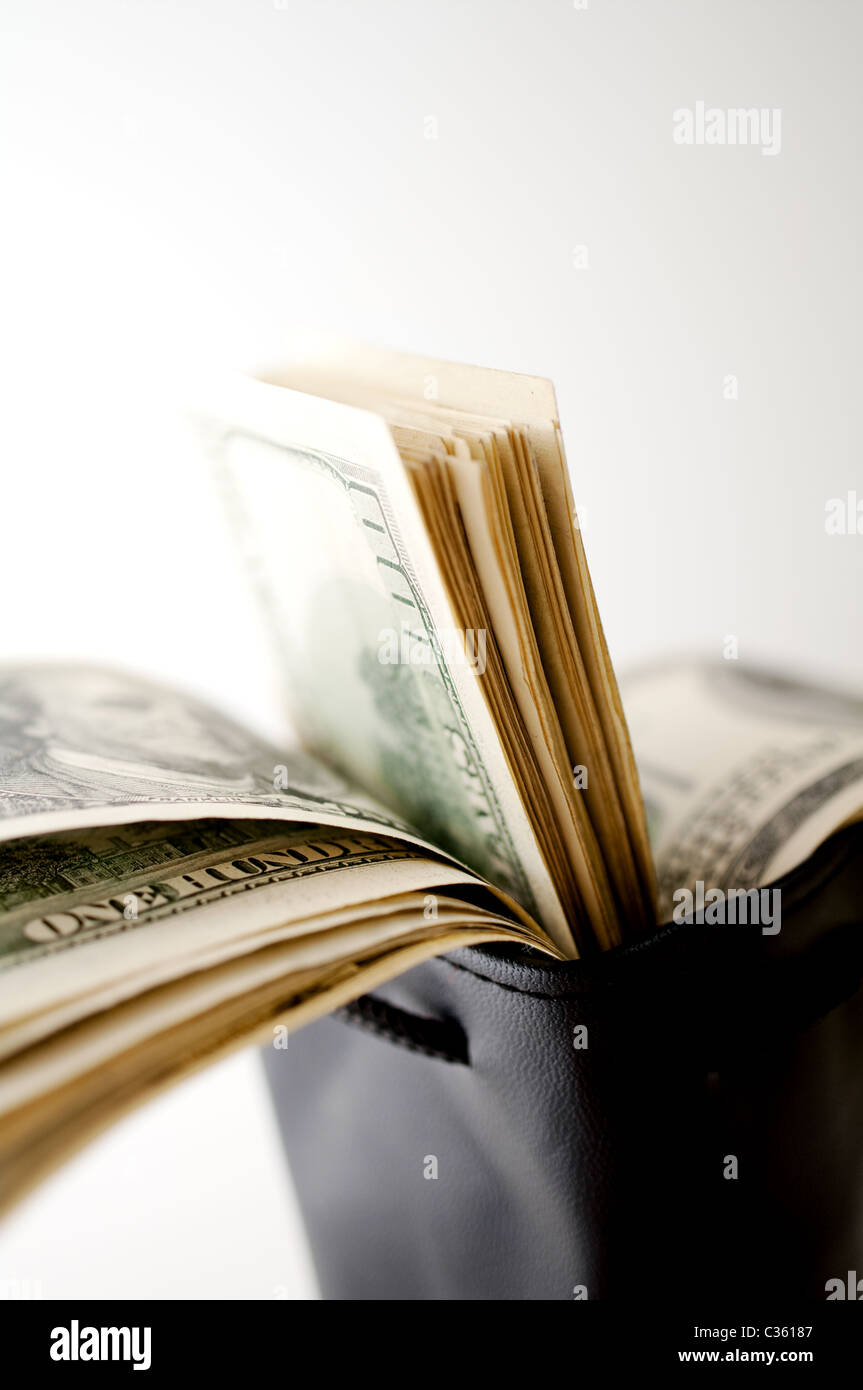 black leather pouch with dollars Stock Photo