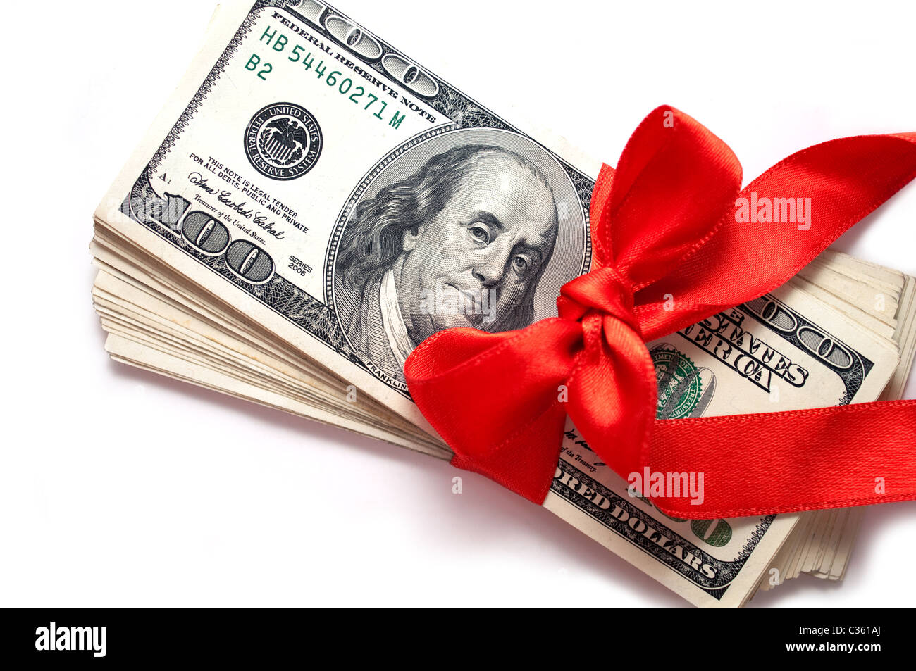Stack of dollar bills with red ribbon isolated on white background ...