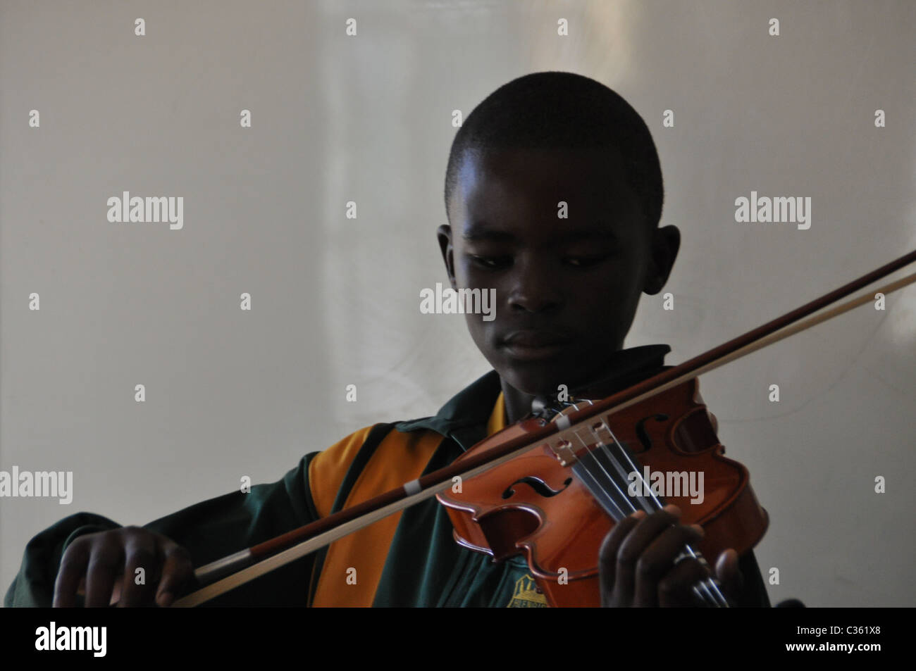 Kids are learning to play the violin in one of the townships around