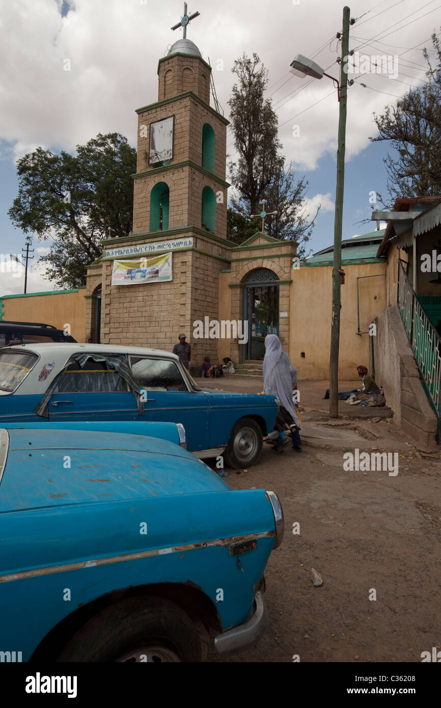 Street scene with antique taxis and church - Old Town, Harar, Ethiopia, Africa Stock Photo
