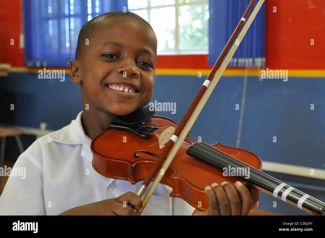 Kids are learning to play the violin in one of the townships around